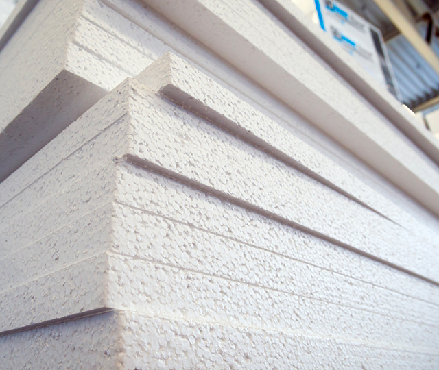 Expanded polystyrene (EPS) insulation boards stacked for residential insulation projects.