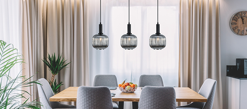 industial style lamp over a dinning table