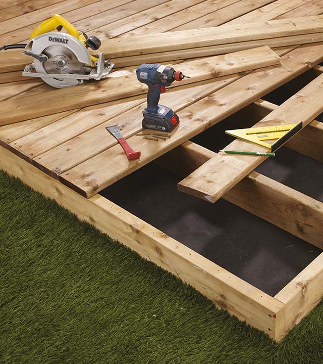 Deck under construction with a ground-level foundation