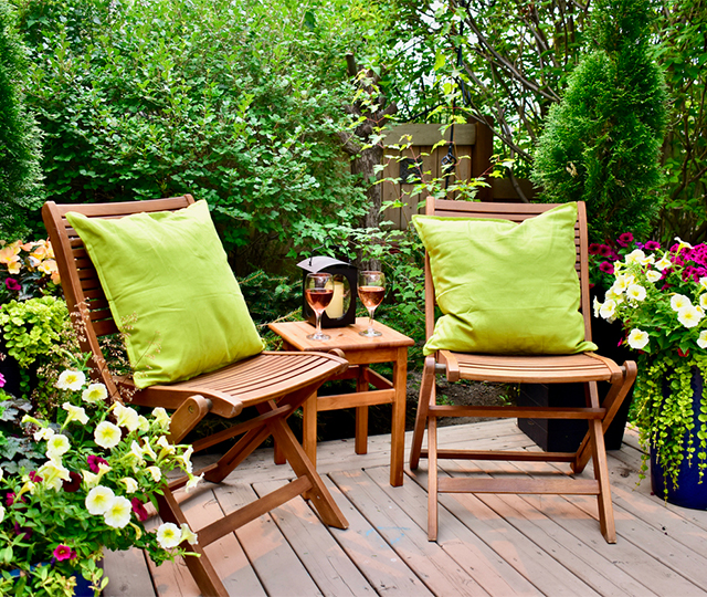 Patio furniture with plants in a lounge area