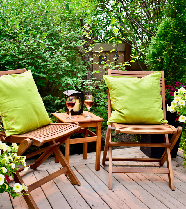 Patio furniture with plants in a lounge area