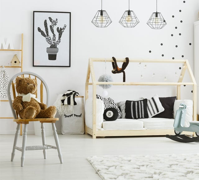 kid bedroom with house bed lamps chair and poster
