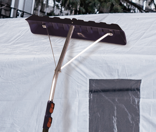 A cover scrapper that clears snow from a car shelter.